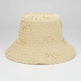 Natural Woven Bucket Hat with Bows on a white background