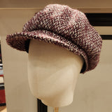 Textured WOOL BURGUNDY hat on a mannequin head against a neutral background
