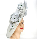 ICE BLUE hat WITH ICE BLUE ORCHIDS, PEARLS, AND GREEN BEADS on a mannequin head with a white background